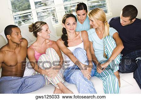 Close-up of a group of people sitting together View Large Photo Image Stock Image - Close-up of a group of people sitting together. Fotosearch