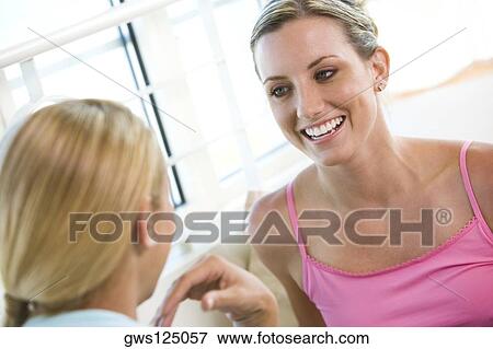 Stock Photo - Close-up of a young woman smiling. Fotosearch