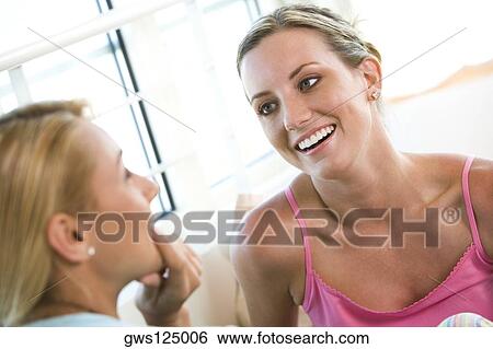Close-up of a young woman smiling View Large Photo Image Stock Photograph - Close-up of a young woman smiling. Fotosearch