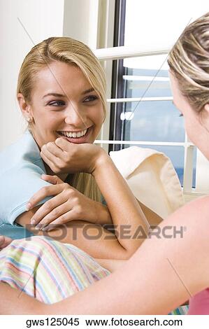 Close-up of a young woman smiling View Large Photo Image Stock Photography - Close-up of a young woman smiling. Fotosearch