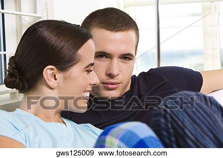 Portrait of a young man and a young woman smiling View Large Photo Image Stock Photo - Portrait of a young man and a young woman smiling. Fotosearch