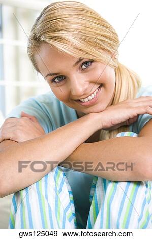 Portrait of a young woman smiling View Large Photo Image Stock Photo - Portrait of a young woman smiling. Fotosearch