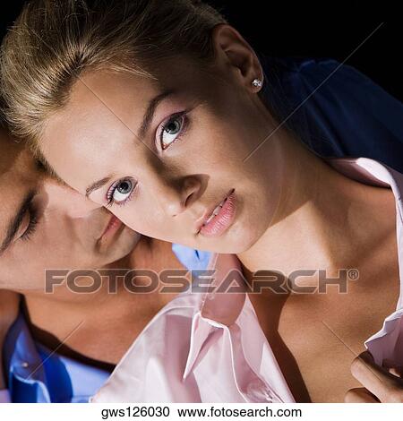 Close-up of a young man kissing a young woman View Large Photo Image Stock Image - Close-up of a young man kissing a young woman. Fotosearch