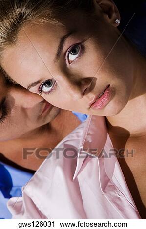 Close-up of a young man kissing a young woman View Large Photo Image Stock Image - Close-up of a young man kissing a young woman. Fotosearch
