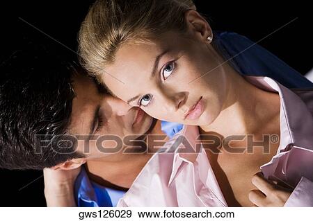 Close-up of a young man kissing a young woman View Large Photo Image Stock Photo - Close-up of a young man kissing a young woman. Fotosearch