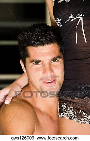 Portrait of a mid adult man embracing a young woman View Large Photo Image Stock Photo - Portrait of a mid adult man embracing a young woman. Fotosearch