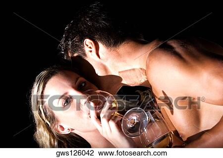 Portrait of a young couple drinking wine View Large Photo Image Stock Image - Portrait of a young couple drinking wine. Fotosearch
