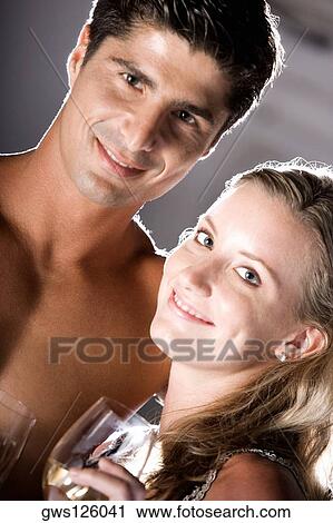 Portrait of a young couple smiling View Large Photo Image Stock Image - Portrait of a young couple smiling. Fotosearch