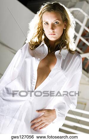 Portrait of a young woman posing View Large Photo Image Stock Photograph - Portrait of a young woman posing. Fotosearch