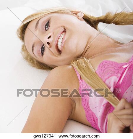Portrait of a young woman smiling View Large Photo Image Stock Image - Portrait of a young woman smiling. Fotosearch
