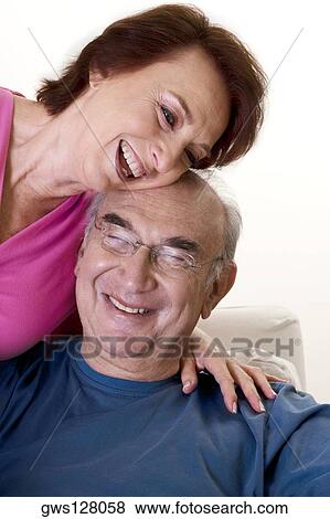 Close-up of a senior couple smiling View Large Photo Image Stock Photo - Close-up of a senior couple smiling. Fotosearch