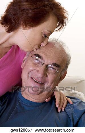 Close-up of a senior woman kissing a senior man View Large Photo Image Stock Photo - Close-up of a senior woman kissing a senior man. Fotosearch