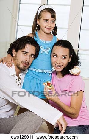 Close-up of parents and their daughter View Large Photo Image Stock Image - Close-up of parents and their daughter. Fotosearch
