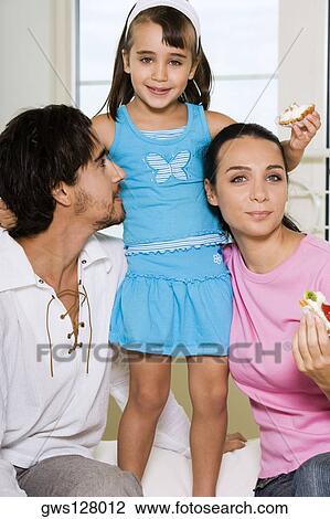 Close-up of parents and their daughter View Large Photo Image Stock Image - Close-up of parents and their daughter. Fotosearch