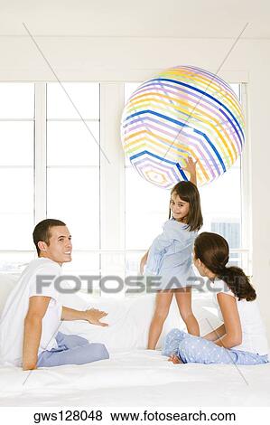 Parents playing with their daughter View Large Photo Image Stock Photo - Parents playing with their daughter. Fotosearch