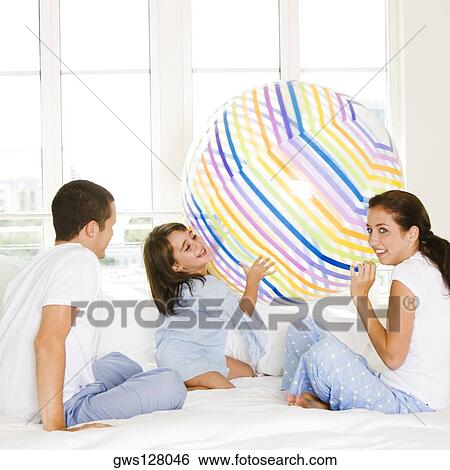 Parents playing with their daughter View Large Photo Image Stock Photograph - Parents playing with their daughter. Fotosearch