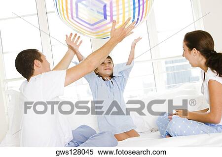 Parents playing with their daughter View Large Photo Image Stock Photography - Parents playing with their daughter. Fotosearch