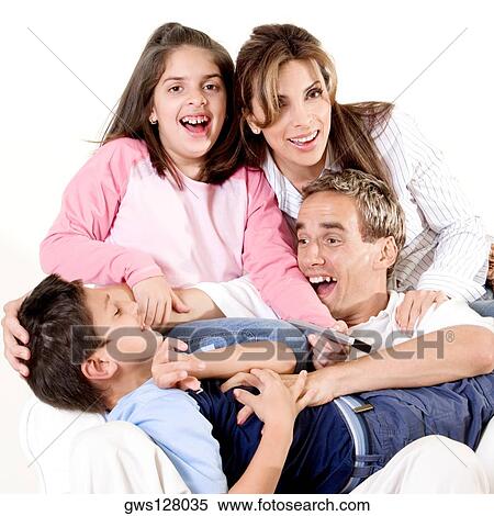 Parents sitting with their son and daughter View Large Photo Image Stock Photography - Parents sitting with their son and daughter. Fotosearch