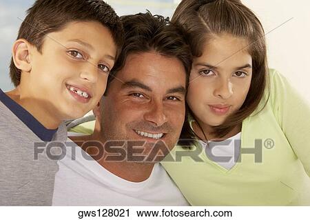 Portrait of a father and his two children View Large Photo Image Stock Image - Portrait of a father and his two children. Fotosearch