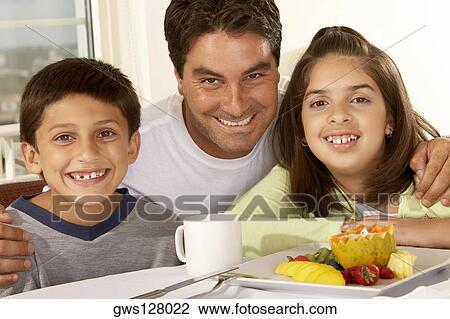 Portrait of a father and his two children View Large Photo Image Stock Image - Portrait of a father and his two children. Fotosearch