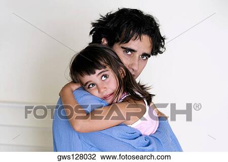 Portrait of a father hugging his daughter View Large Photo Image Stock Image - Portrait of a father hugging his daughter. Fotosearch