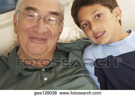 Stock Photo - Portrait of a grandfather smiling with his grandson. Fotosearch