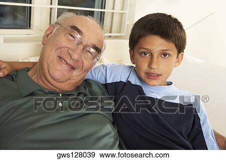 Portrait of a grandfather smiling with his grandson View Large Photo Image Stock Photo - Portrait of a grandfather smiling with his grandson. Fotosearch