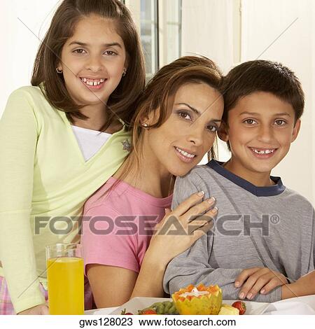 Portrait of a mother and her two children View Large Photo Image Stock Image - Portrait of a mother and her two children. Fotosearch