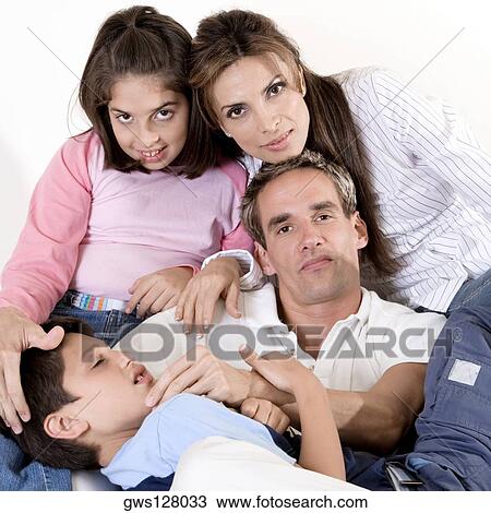 Portrait of parents sitting with their son and daughter View Large Photo Image Stock Image - Portrait of parents sitting with their son and daughter. Fotosearch