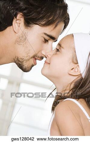 Side profile of a father and his daughter nuzzling View Large Photo Image Stock Image - Side profile of a father and his daughter nuzzling. Fotosearch
