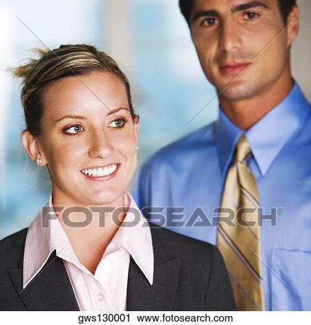 Stock Image - Close-up of a businessman and a businesswoman. Fotosearch