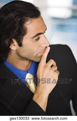 Close-up of a businessman looking sideways View Large Photo Image Stock Image - Close-up of a businessman looking sideways. Fotosearch