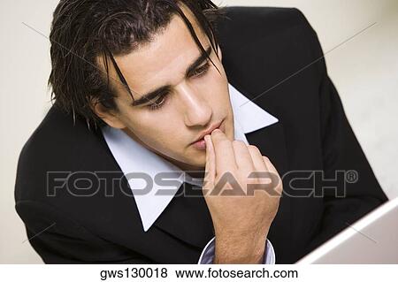 Close-up of a businessman with his finger on his lips View Large Photo Image Stock Photo - Close-up of a businessman with his finger on his lips. Fotosearch