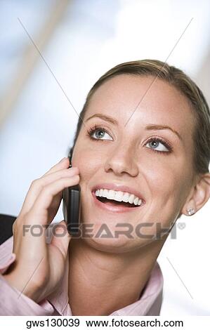 Stock Photo - Close-up of a businesswoman talking on a mobile phone. Fotosearch