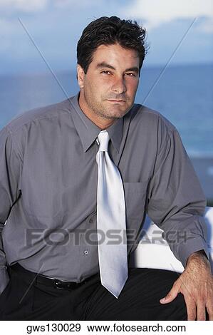 Portrait of a businessman thinking View Large Photo Image Stock Photo - Portrait of a businessman thinking. Fotosearch