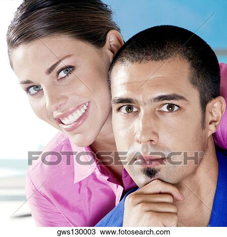 Stock Image - Portrait of a businesswoman and a businessman smiling. Fotosearch
