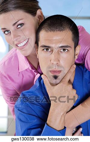 Stock Photo - Portrait of a businesswoman and a businessman smiling. Fotosearch