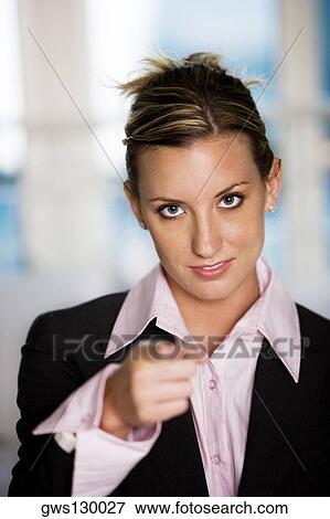Portrait of a businesswoman pointing forward View Large Photo Image Stock Photo - Portrait of a businesswoman pointing forward. Fotosearch