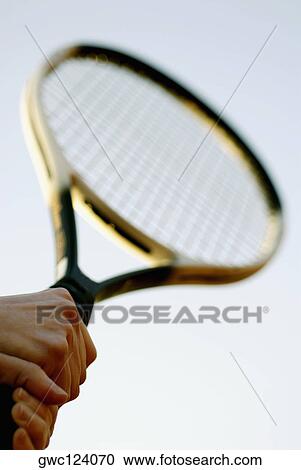 Close-up of a person's hand holding a tennis racket View Large Photo Image Stock Image - Close-up of a person's hand holding a tennis racket. Fotosearch