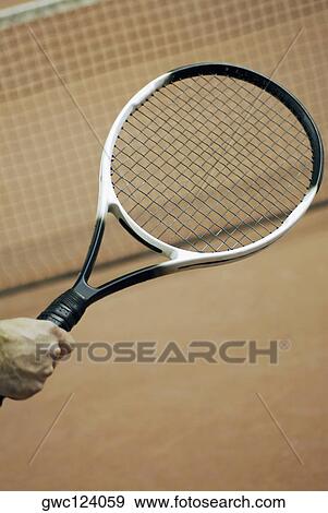 Close-up of a person's hand holding a tennis racket View Large Photo Image Stock Photo - Close-up of a person's hand holding a tennis racket. Fotosearch