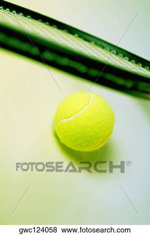 Close-up of a tennis ball and a tennis racket View Large Photo Image Stock Photo - Close-up of a tennis ball and a tennis racket. Fotosearch
