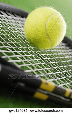 Close-up of a tennis ball on a tennis racket View Large Photo Image Stock Photography - Close-up of a tennis ball on a tennis racket. Fotosearch