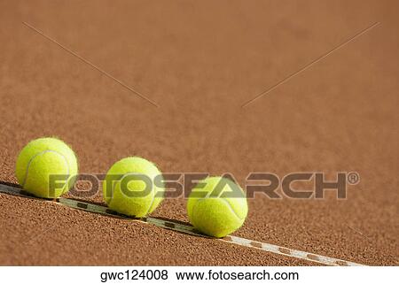 Close-up of three tennis balls on the yard line View Large Photo Image Stock Photo - Close-up of three tennis balls on the yard line. Fotosearch