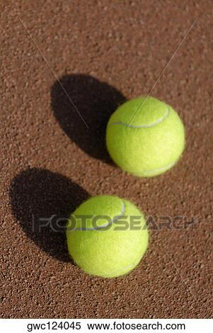 Close-up of two tennis balls on a tennis court View Large Photo Image Stock Photography - Close-up of two tennis balls on a tennis court. Fotosearch