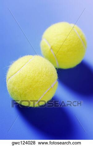Stock Photo - Close-up of two tennis balls. Fotosearch