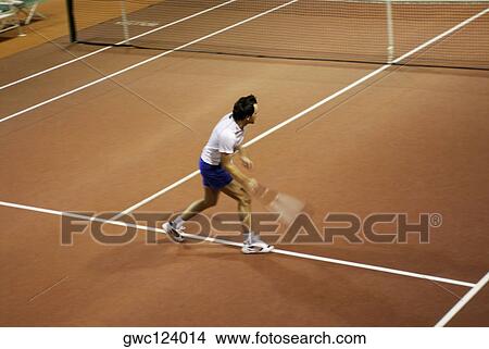 High angle view of a mid adult man playing tennis View Large Photo Image Picture - High angle view of a mid adult man playing tennis. Fotosearch