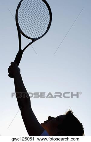 Close-up of a mid adult woman holding a tennis racket View Large Photo Image Stock Image - Close-up of a mid adult woman holding a tennis racket. Fotosearch