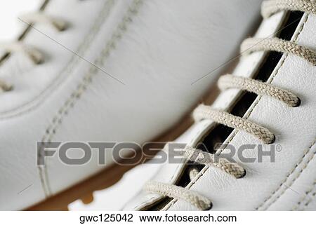 Stock Image - Close-up of a pair of sports shoes. Fotosearch