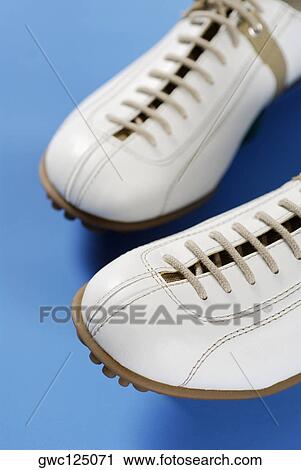 Stock Image - Close-up of a pair of sports shoes. Fotosearch