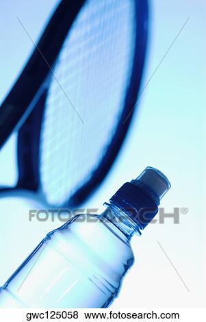 Close-up of a tennis racket with a water bottle View Large Photo Image Stock Photo - Close-up of a tennis racket with a water bottle. Fotosearch